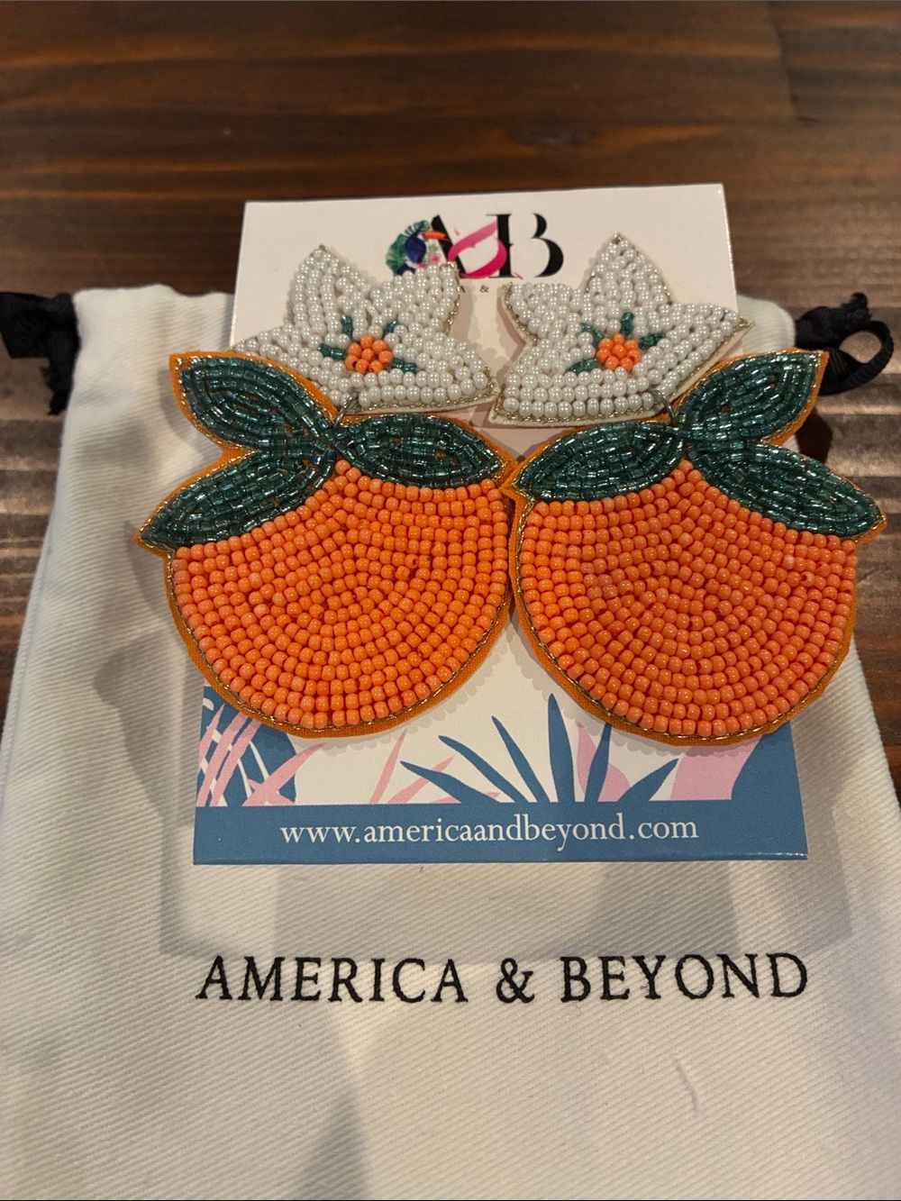 America & Beyond Orange Bead Fruit Drop Earrings with Green Leaf Detail